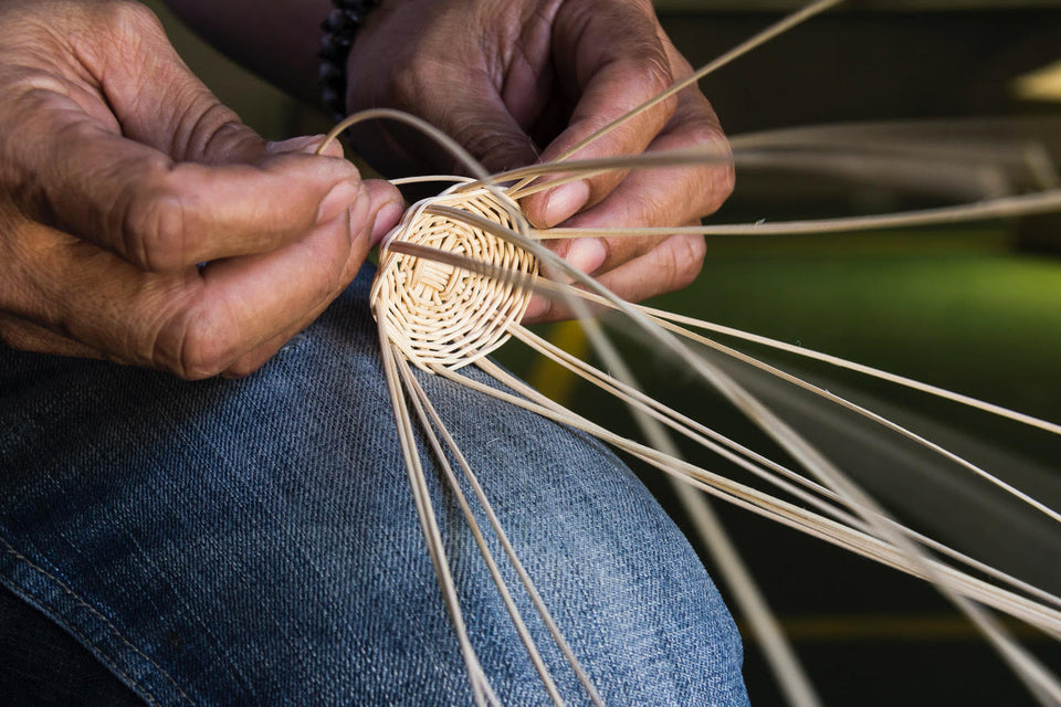 fingers of artisan weaver rattan weaving