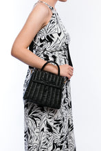Load image into Gallery viewer, Adie wicker black shoulder bag, handwoven from sustainable rattan with a cotton strap and brass hardware, perfect for eco-conscious style.