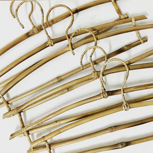 Set of 6 eco-friendly bamboo hangers, perfect for sustainable wardrobes, lightweight and durable for various garments.