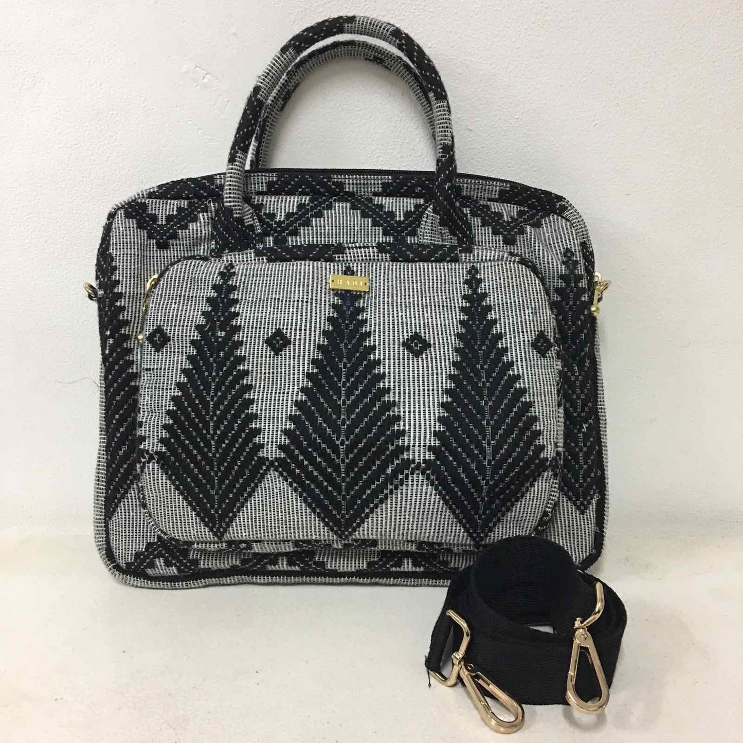 Handwoven Abel Iloco laptop bag with geometric designs, faux suede non-slip top, and handle. Ethically crafted in the Philippines.