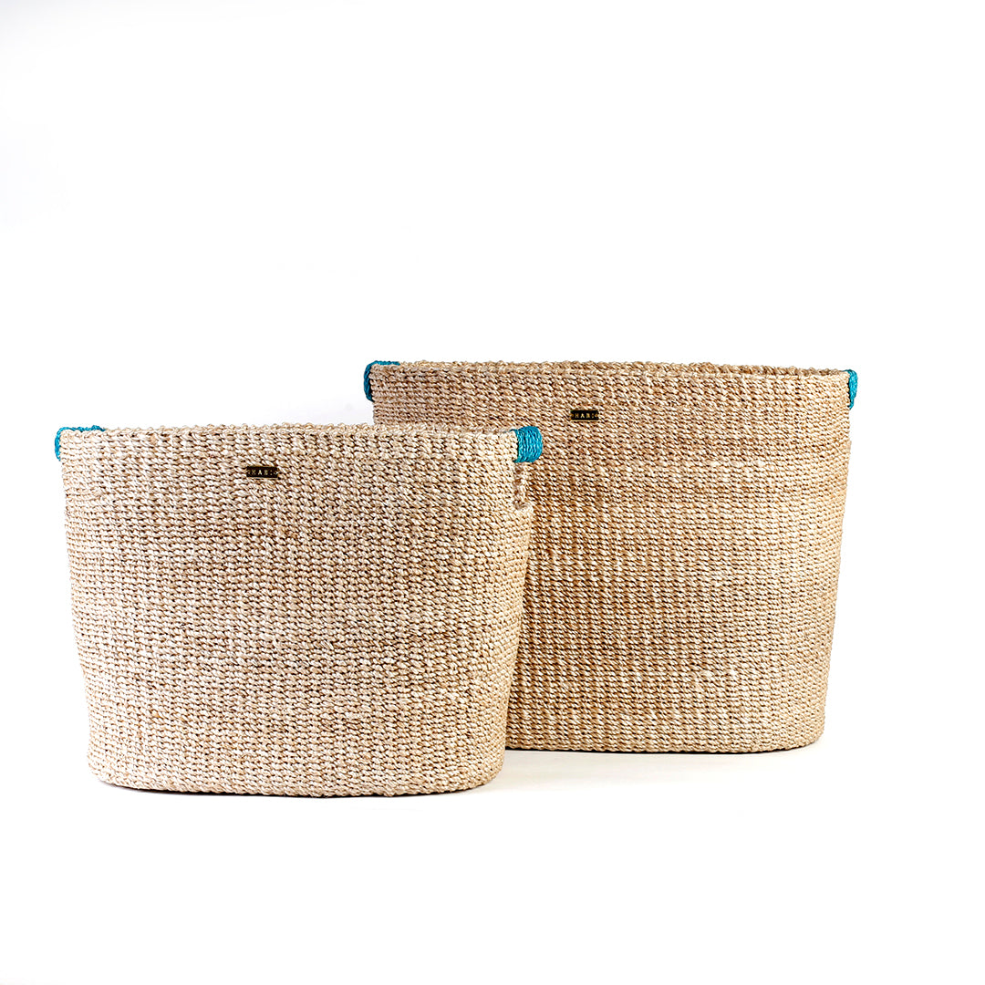 Ivy Oval Storage Baskets Set of 2, handcrafted from natural plant fibers, shown in small and large sizes for stylish and eco-friendly home organization.