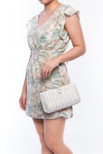 Load image into Gallery viewer, Myra Wicker Clutch White, handcrafted from rattan with a brass chain strap and a soft linen-cotton lining, perfect for day and evening wear.