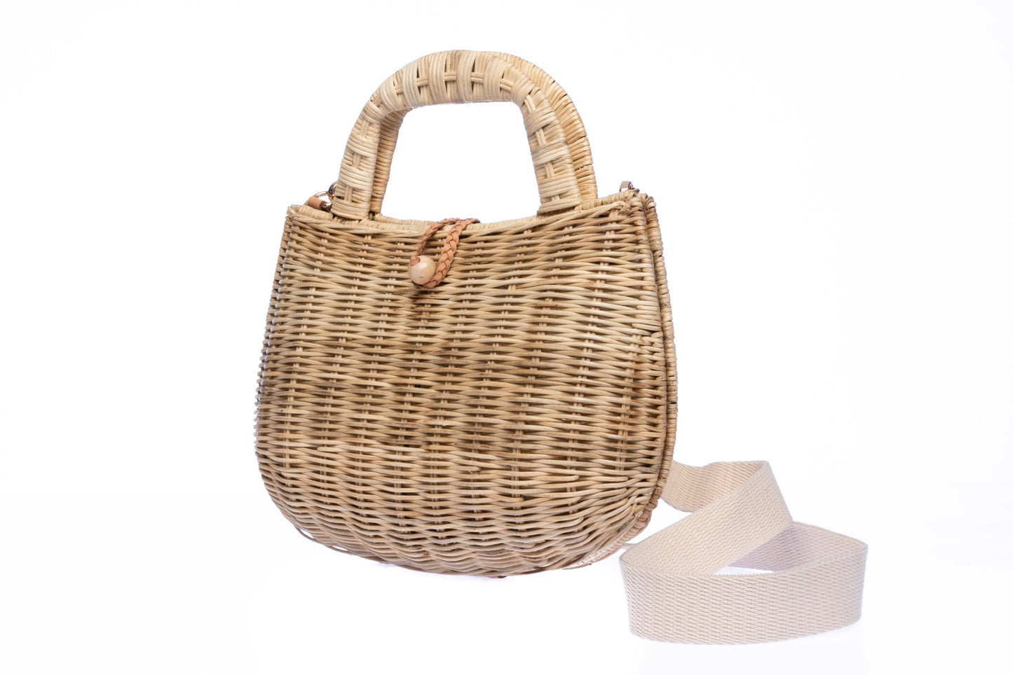Handwoven Abi Wicker Natural Rattan Shoulder Bag with cotton strap and brass hardware, eco-friendly design, and artisan-crafted in the Philippines.
