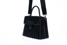 Load image into Gallery viewer, Adie wicker black shoulder bag, handwoven from sustainable rattan with a cotton strap and brass hardware, perfect for eco-conscious style.