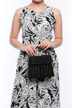 Load image into Gallery viewer, Adie wicker black shoulder bag, handwoven from sustainable rattan with a cotton strap and brass hardware, perfect for eco-conscious style.