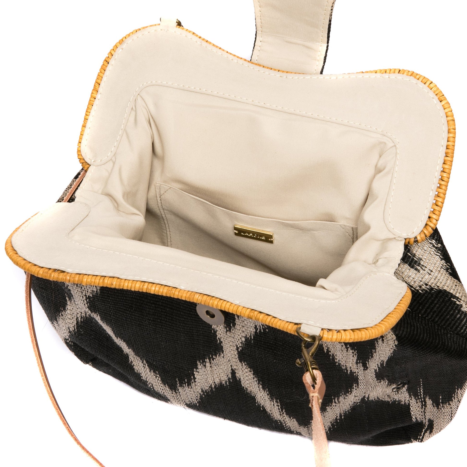 Diamond Dusk Libby handwoven purse with a rattan frame, diamond pattern, and leather strap. A versatile and eco-friendly accessory.