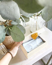 Load image into Gallery viewer, Karuna Raffia Jewelry Box crafted from handwoven natural plant fiber raffia with an agate stone accent capped in hand-tooled brass, perfect for stylish and eco-friendly jewelry storage.