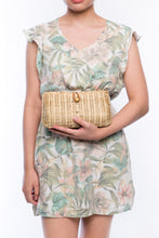 Load image into Gallery viewer, Myra Wicker Clutch Natural handwoven from rattan, featuring a brass chain strap and a soft linen-cotton lining, perfect for both day and night occasions.