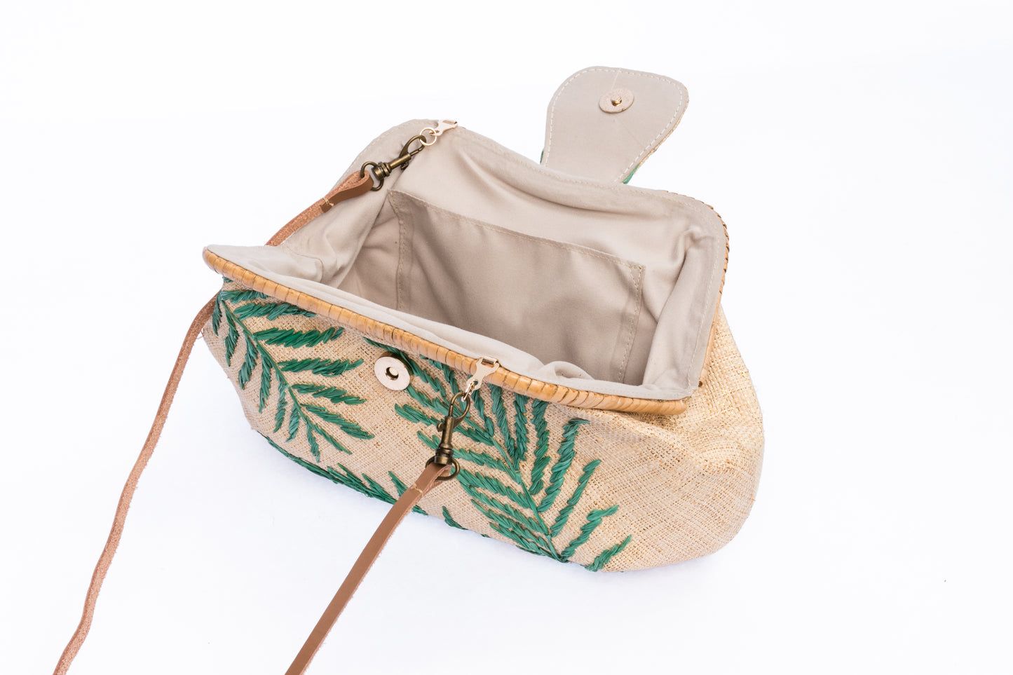 Palm Leaves Signature Larone Purse, handwoven from raffia with embroidered daisies and a rattan frame, featuring a leather strap for a sustainable, chic accessory.