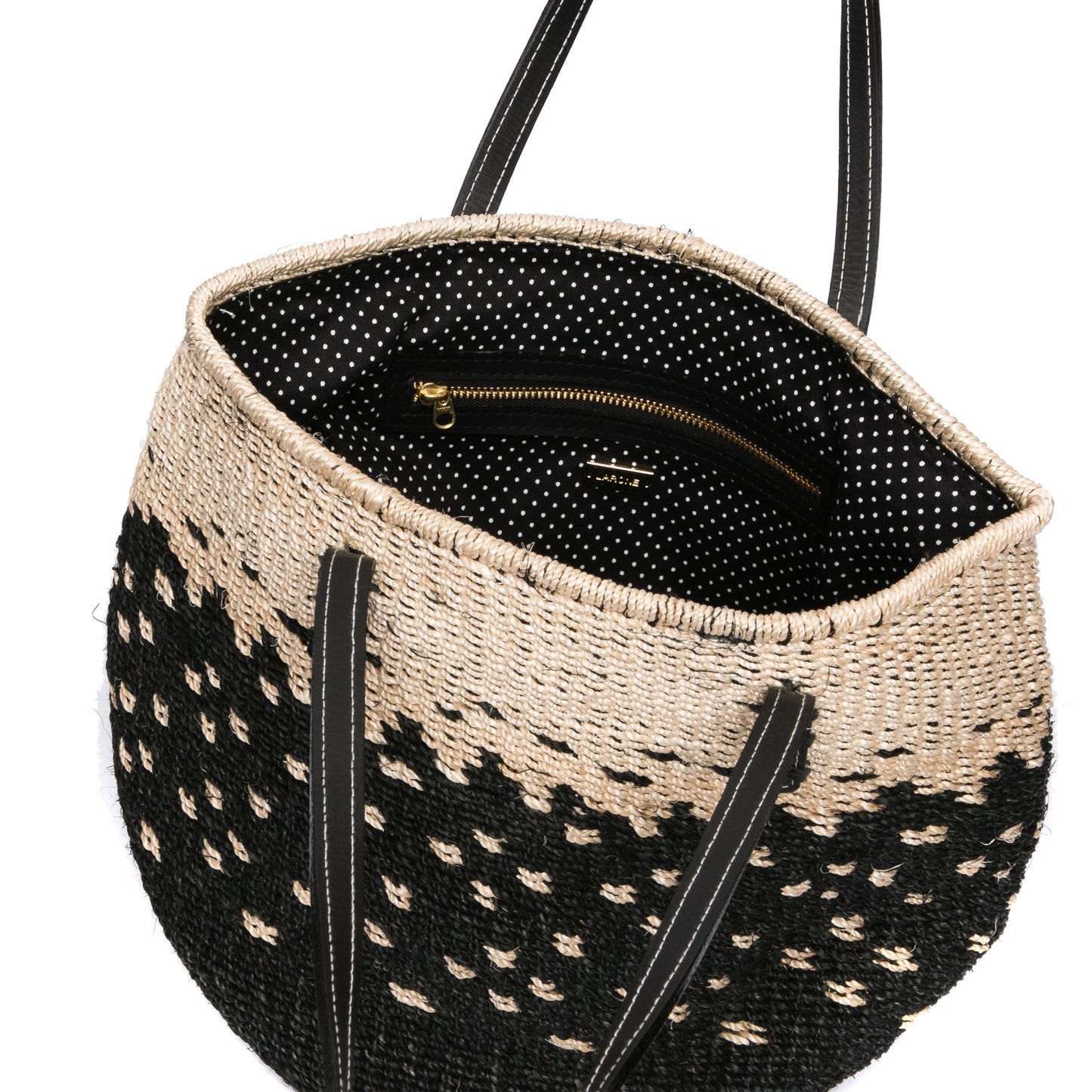 Starry Night Tote made from natural plant fiber with soft cow leather handles and a spacious interior for everyday essentials. Perfect for casual or elegant outfits.