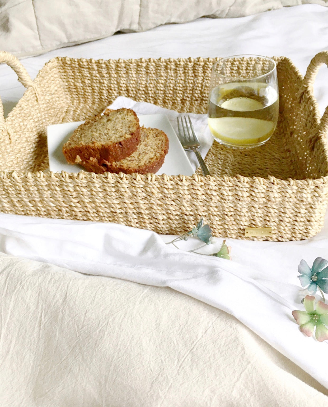Stephanie Trays Set of 2, crafted from 100% natural plant fiber, ideal for organizing and displaying items around the home.