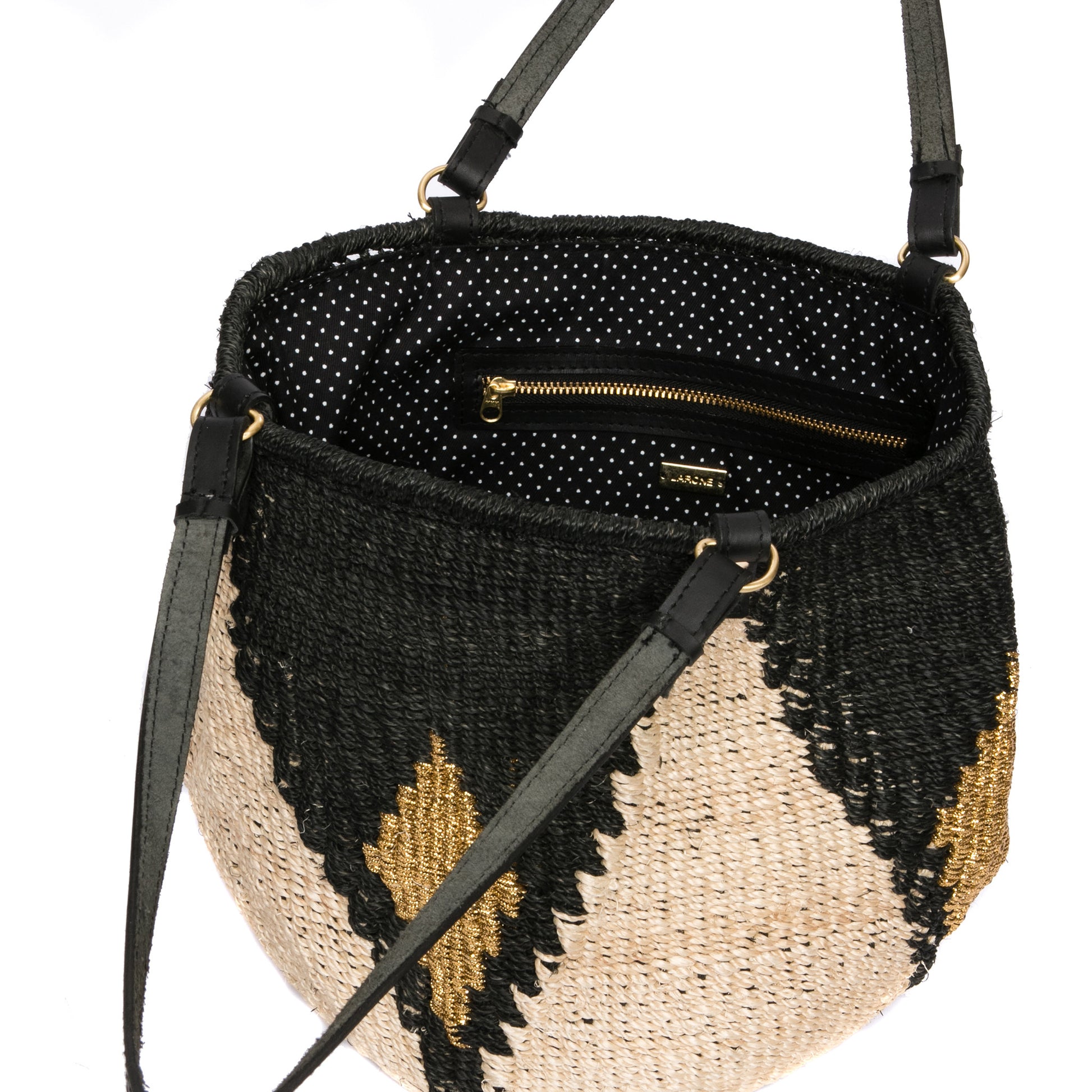 Sunset Rae Tote made from natural plant fibers and gold polyester cord with leather handles, offering a stylish and sustainable option for daily use.