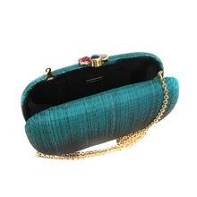 Load image into Gallery viewer, Turquoise Dream Oval Hard Case Purse made from handwoven Buri fiber, adorned with agate stones and brass accents, with a versatile drop-in brass chain for carrying as a clutch or shoulder bag.