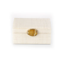 Load image into Gallery viewer, Karuna Raffia Jewelry Box crafted from handwoven natural plant fiber raffia with an agate stone accent capped in hand-tooled brass, perfect for stylish and eco-friendly jewelry storage.