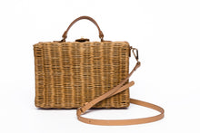 Load image into Gallery viewer, Mio Wicker Rattan Lunchbox with leather crossbody strap, handwoven from sustainable rattan, featuring clean lines and a minimalist design.