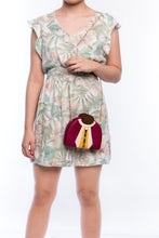 Load image into Gallery viewer, Gatsby Raspberry half-moon clutch made from handwoven natural plant fibers with a cracked sea shell bar and a brass chain strap, adding glamour and sophistication for any evening event.