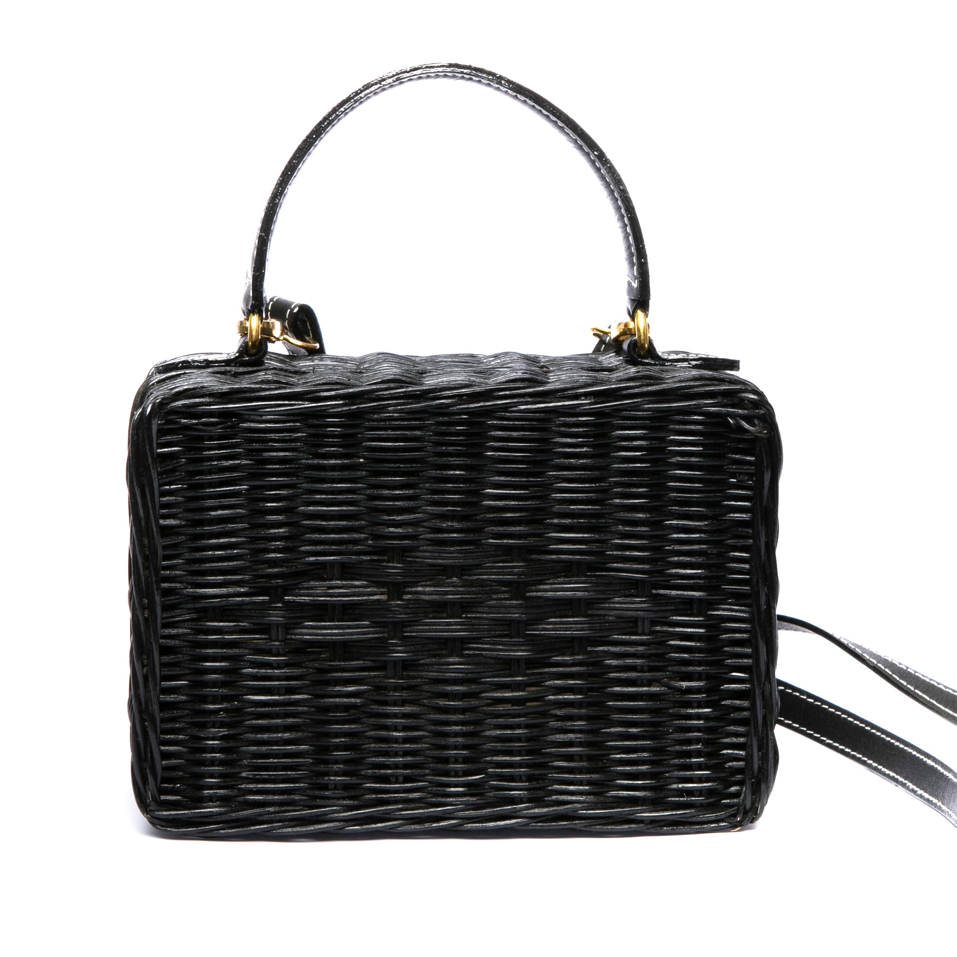 Serene Waters Wicker Bag made from handwoven rattan with an adjustable leather strap and cotton lining. Perfect for holding essentials with a chic and sustainable design.