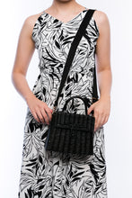 Load image into Gallery viewer, Adie wicker black shoulder bag, handwoven from sustainable rattan with a cotton strap and brass hardware, perfect for eco-conscious style.
