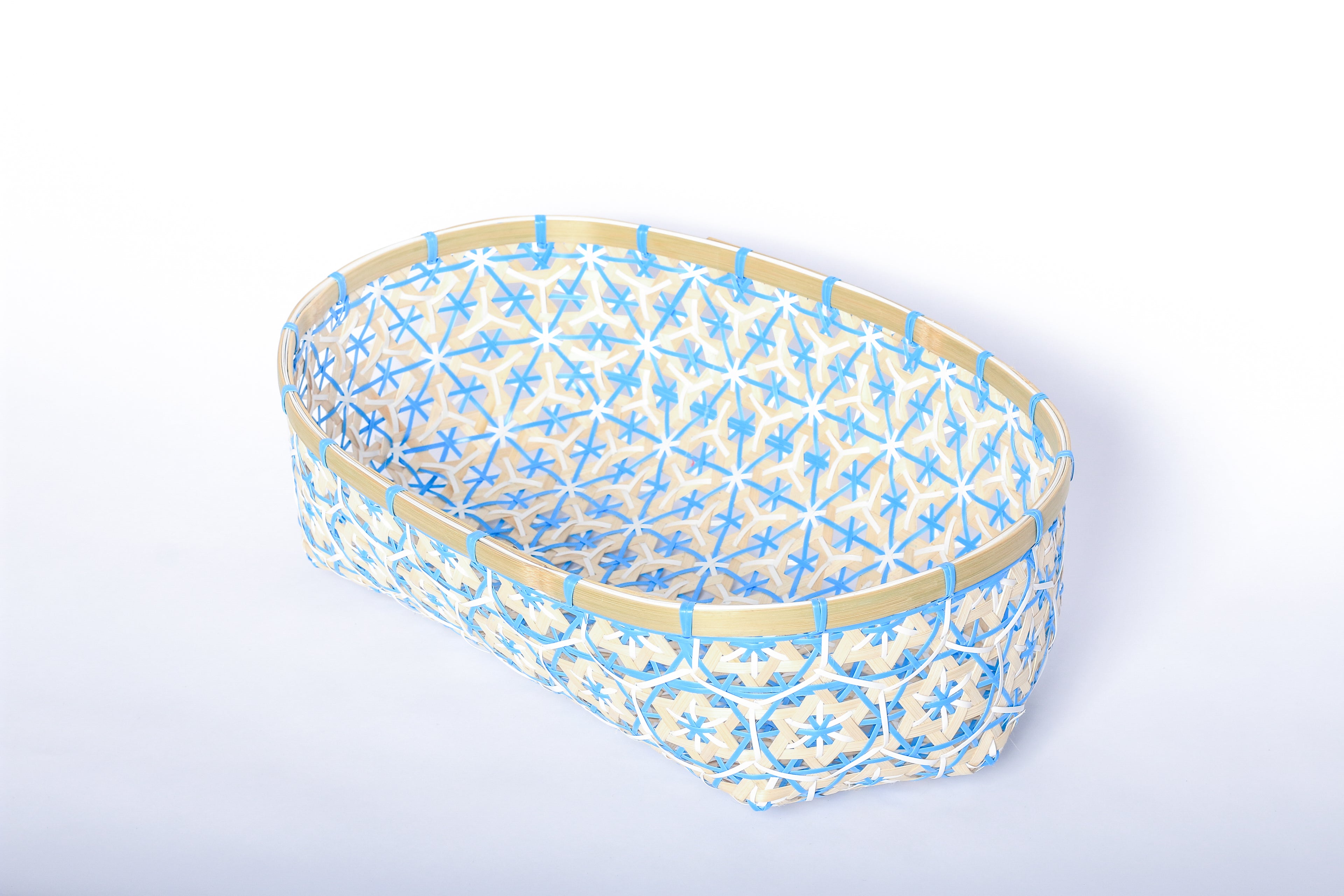 Blue Faustina Festive Star Bread and Fruit Basket made from 100% natural plant fiber, featuring a celestial star motif. Perfect for organizing bread, fruits, and essentials while adding a decorative touch to your home. Sustainable design for eco-friendly living.