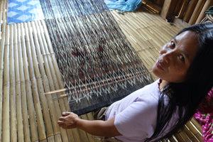 Tboli weaver woman smiling tinalak weaving indigenous tribe crafts back strap loom handmade