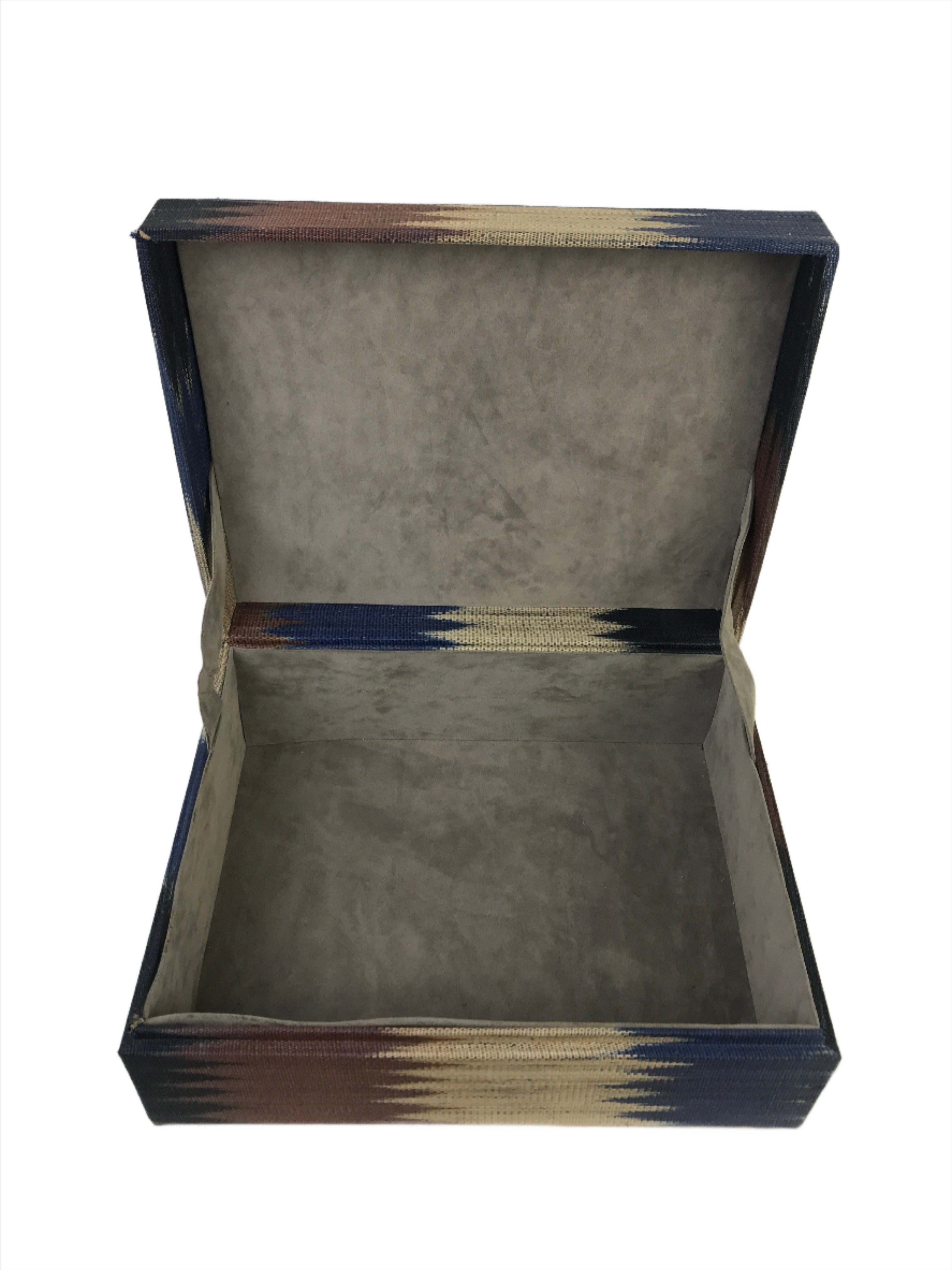 Duane Earth Colors Large Storage Box crafted from 100% abaca T’nalak fabric by the Tboli tribe. Eco-friendly storage box with intricate nature-inspired patterns, blending cultural heritage and modern design for stylish, sustainable organization.