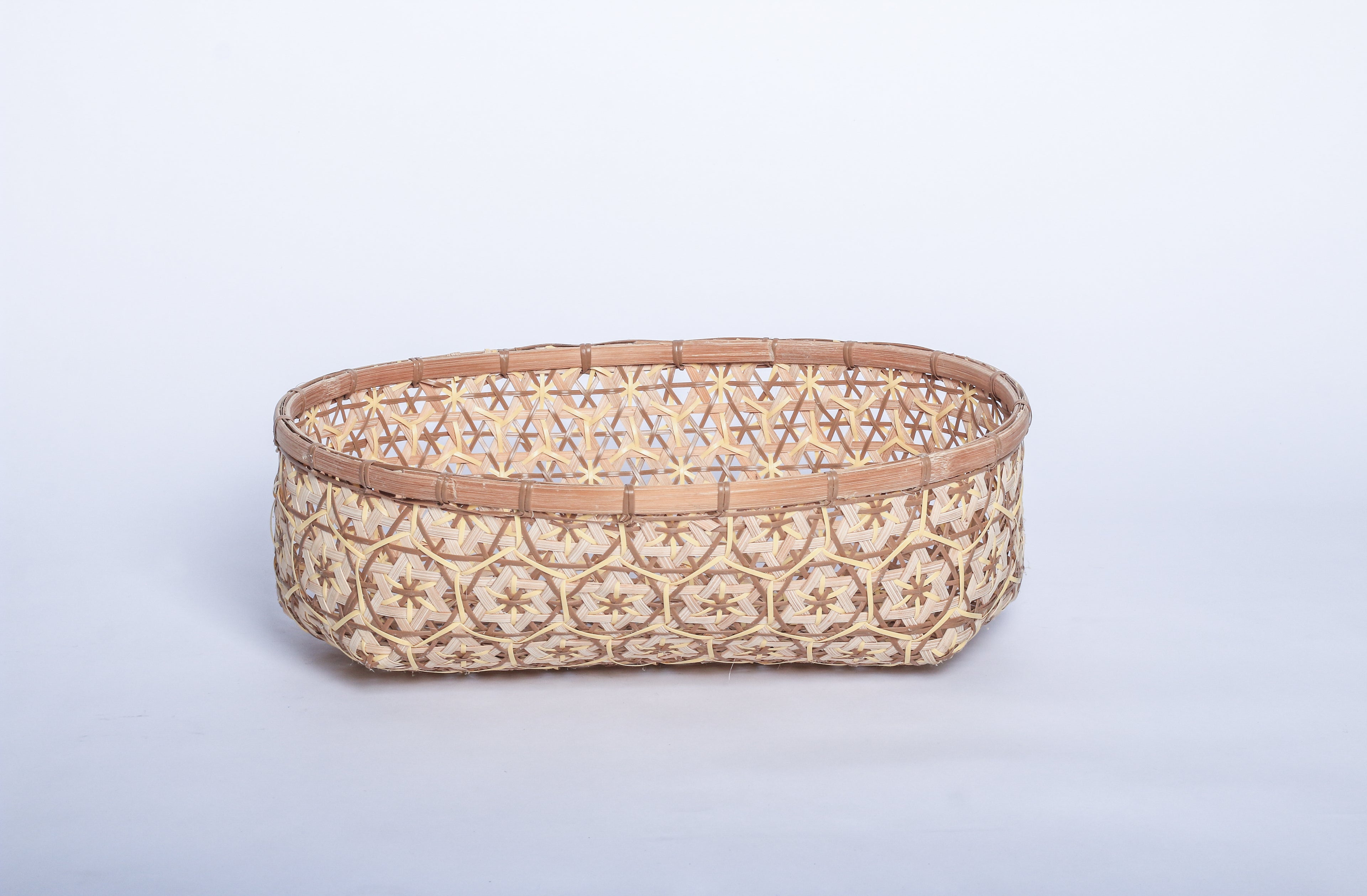 Nude Faustina Festive Star Bread and Fruit Basket made from 100% natural plant fiber, featuring a celestial star motif. Perfect for organizing bread, fruits, and essentials while adding a decorative touch to your home. Sustainable design for eco-friendly living.