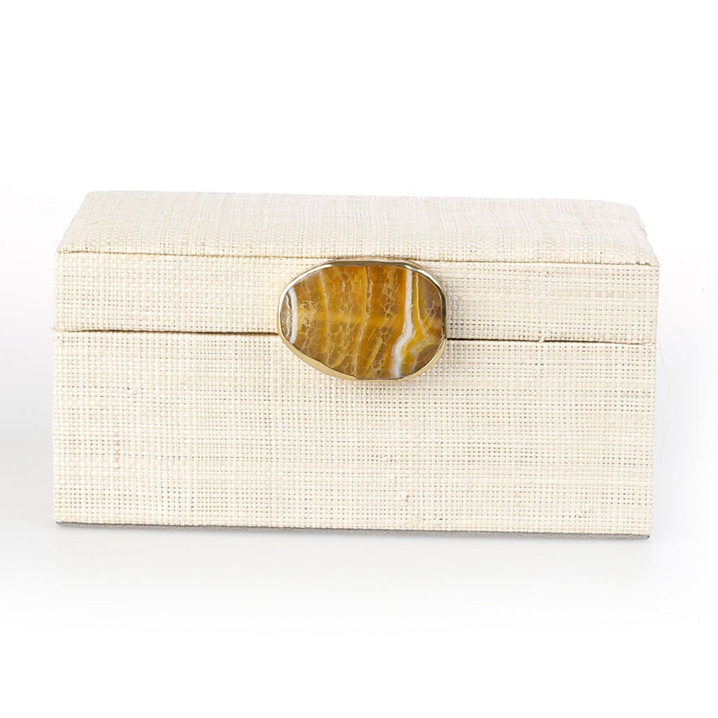 Karuna Raffia Jewelry Box, handcrafted from 100% natural raffia with a polished agate stone accent and hand-tooled brass detailing. Elegant, eco-friendly storage for jewelry and keepsakes.