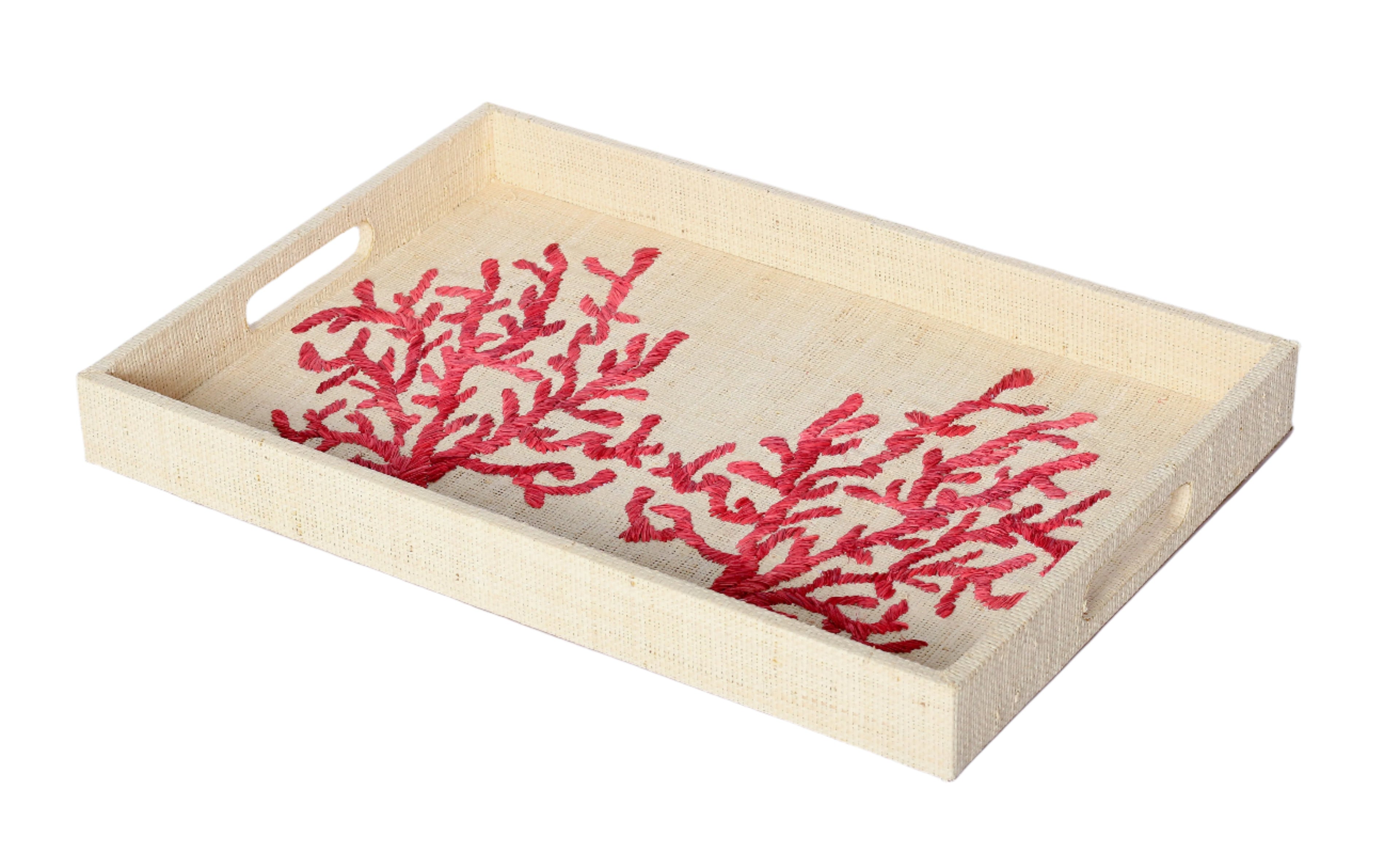 Elevate your home decor with Penelope Coral Red Embroidered Trays made from eco-friendly raffia. Featuring elegant embroidery, these versatile trays serve as both functional and stylish accents for organizing or serving.