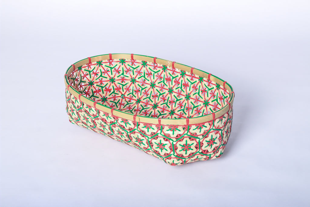 Red and Green Faustina Festive Star Bread and Fruit Basket made from 100% natural plant fiber, featuring a celestial star motif. Perfect for organizing bread, fruits, and essentials while adding a decorative touch to your home. Sustainable design for eco-friendly living.