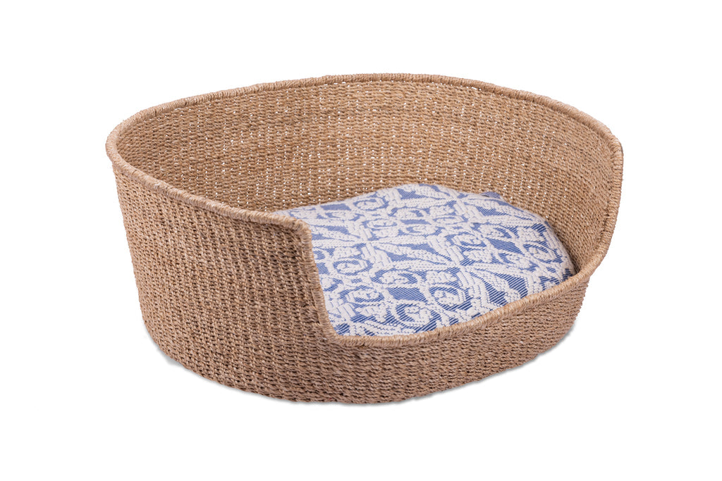 Eco-friendly Tippy Pet Bed made from 100% natural plant fiber with a stylish Inabel handwoven fabric cushion. Perfect for small dogs and cats, offering comfort and sophistication for modern Filipino interiors.