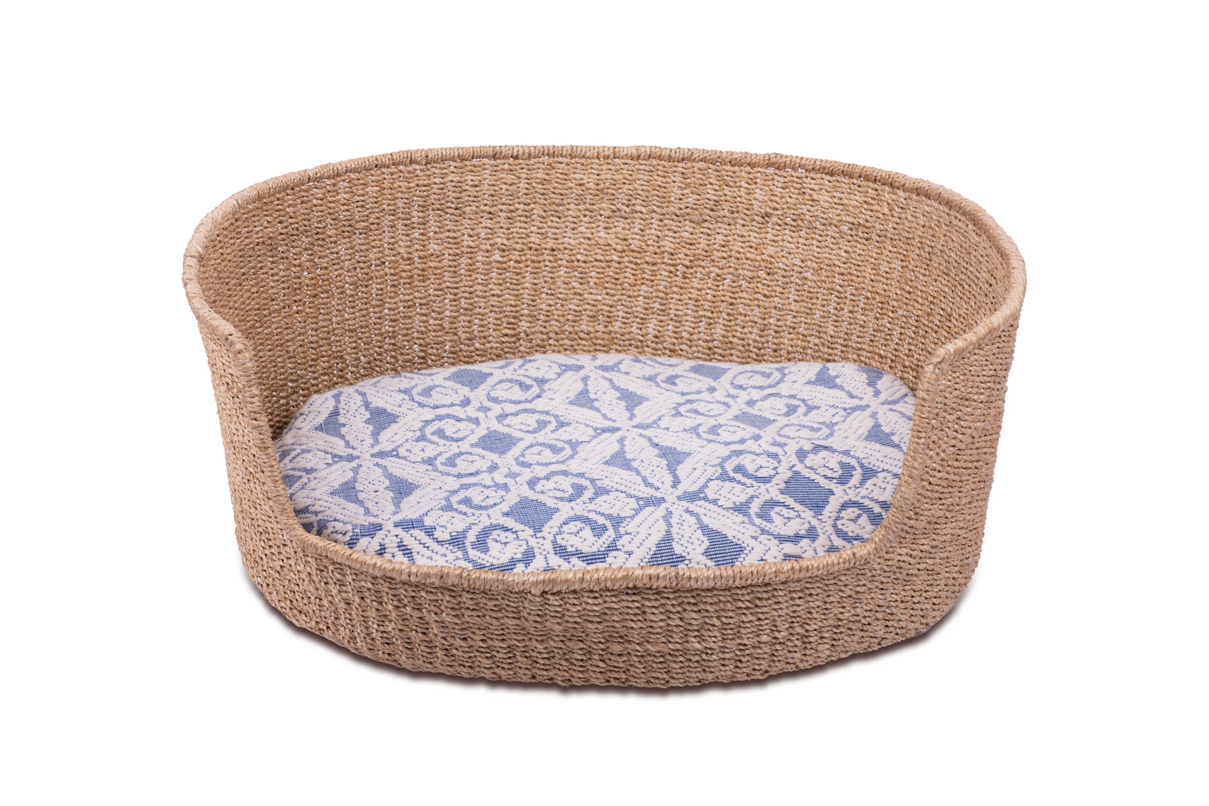 Eco-friendly Tippy Pet Bed made from 100% natural plant fiber with a stylish Inabel handwoven fabric cushion. Perfect for small dogs and cats, offering comfort and sophistication for modern Filipino interiors.