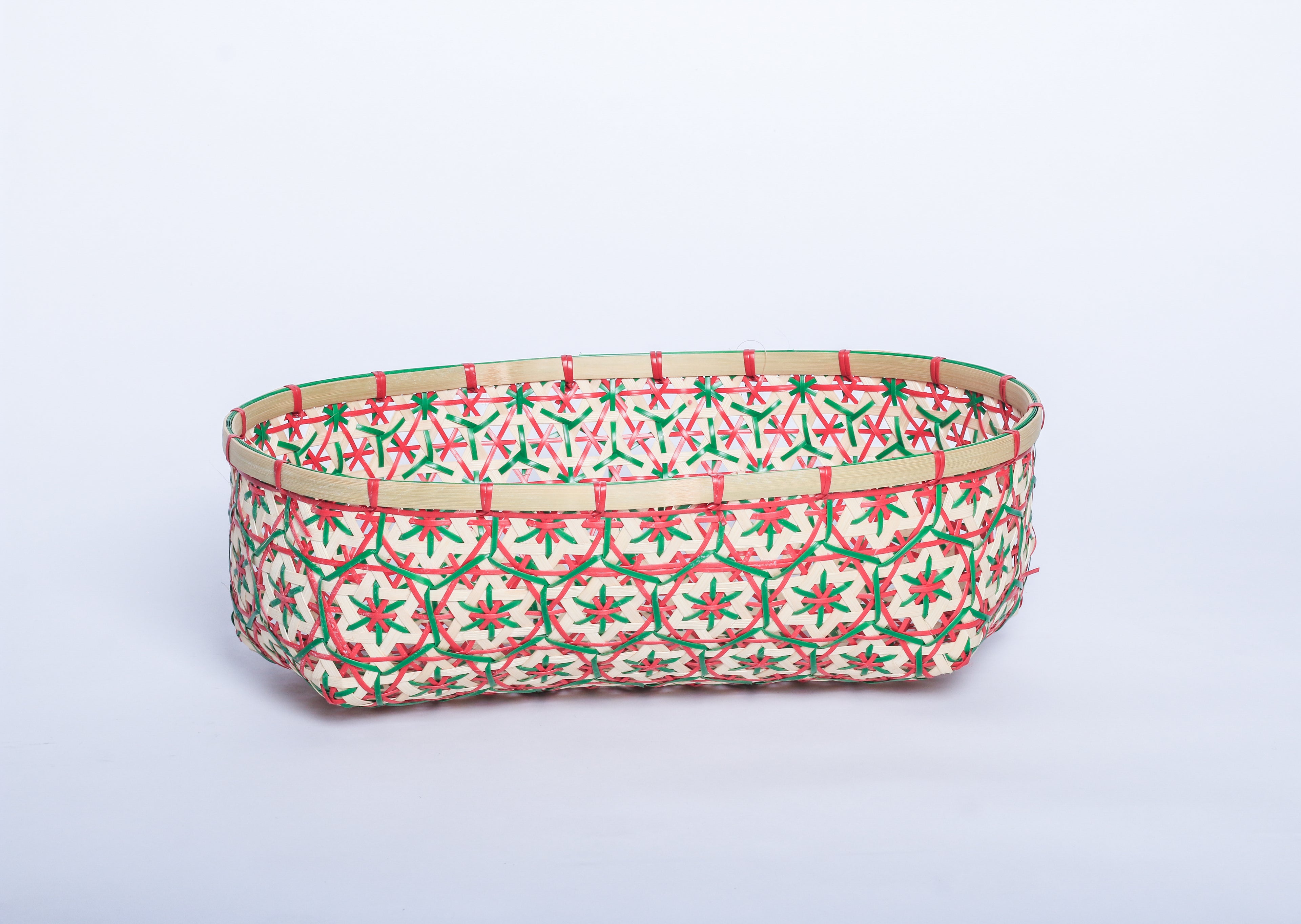 Red and Green Faustina Festive Star Bread and Fruit Basket made from 100% natural plant fiber, featuring a celestial star motif. Perfect for organizing bread, fruits, and essentials while adding a decorative touch to your home. Sustainable design for eco-friendly living.