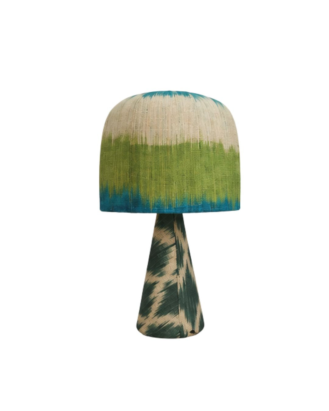 Front view of a green and blue ikat pattern dome table lamp with a patterned conical base against a white background.