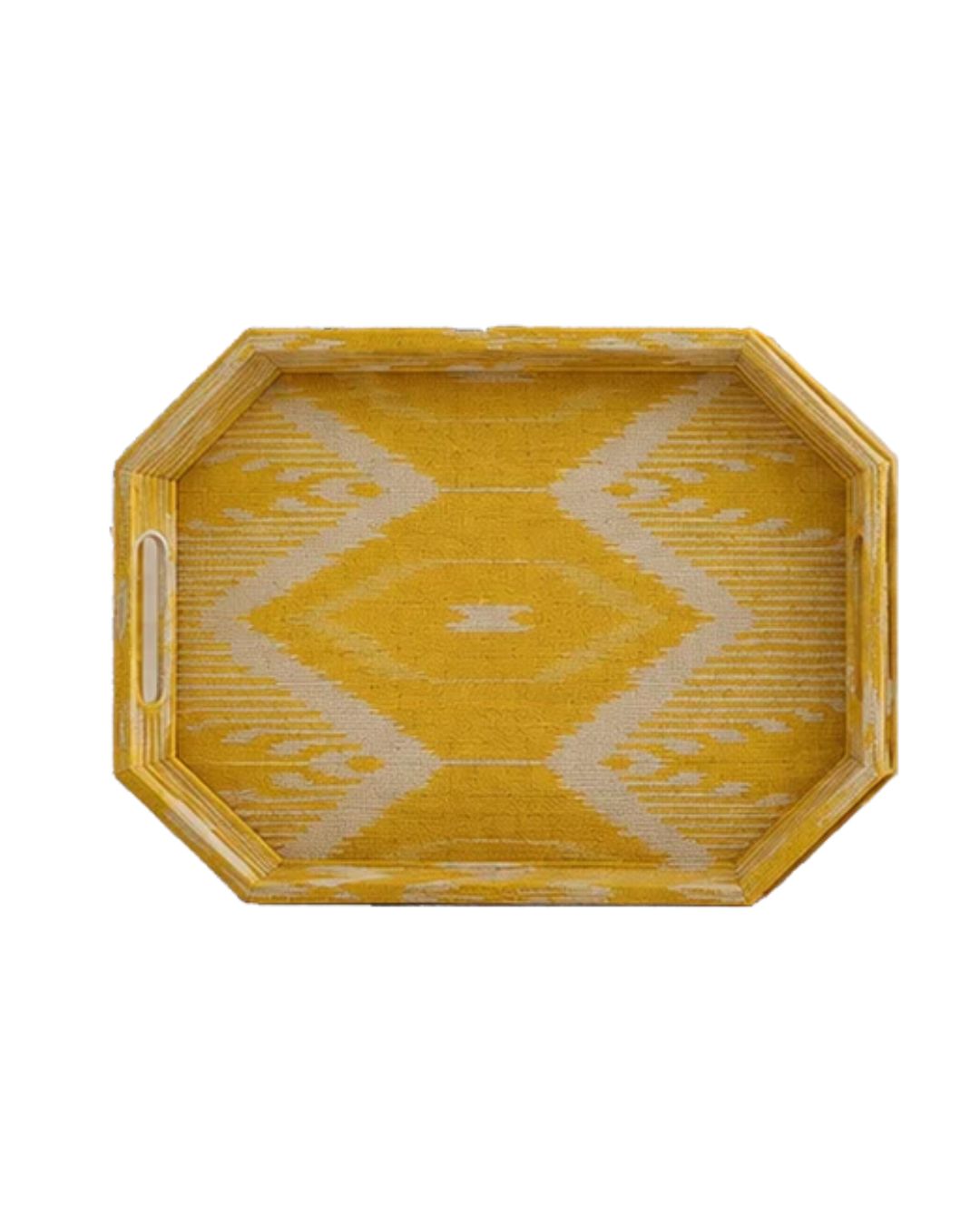 Top-down view of a mustard yellow and cream geometric ikat patterned octagonal decorative tray with cutout handles.