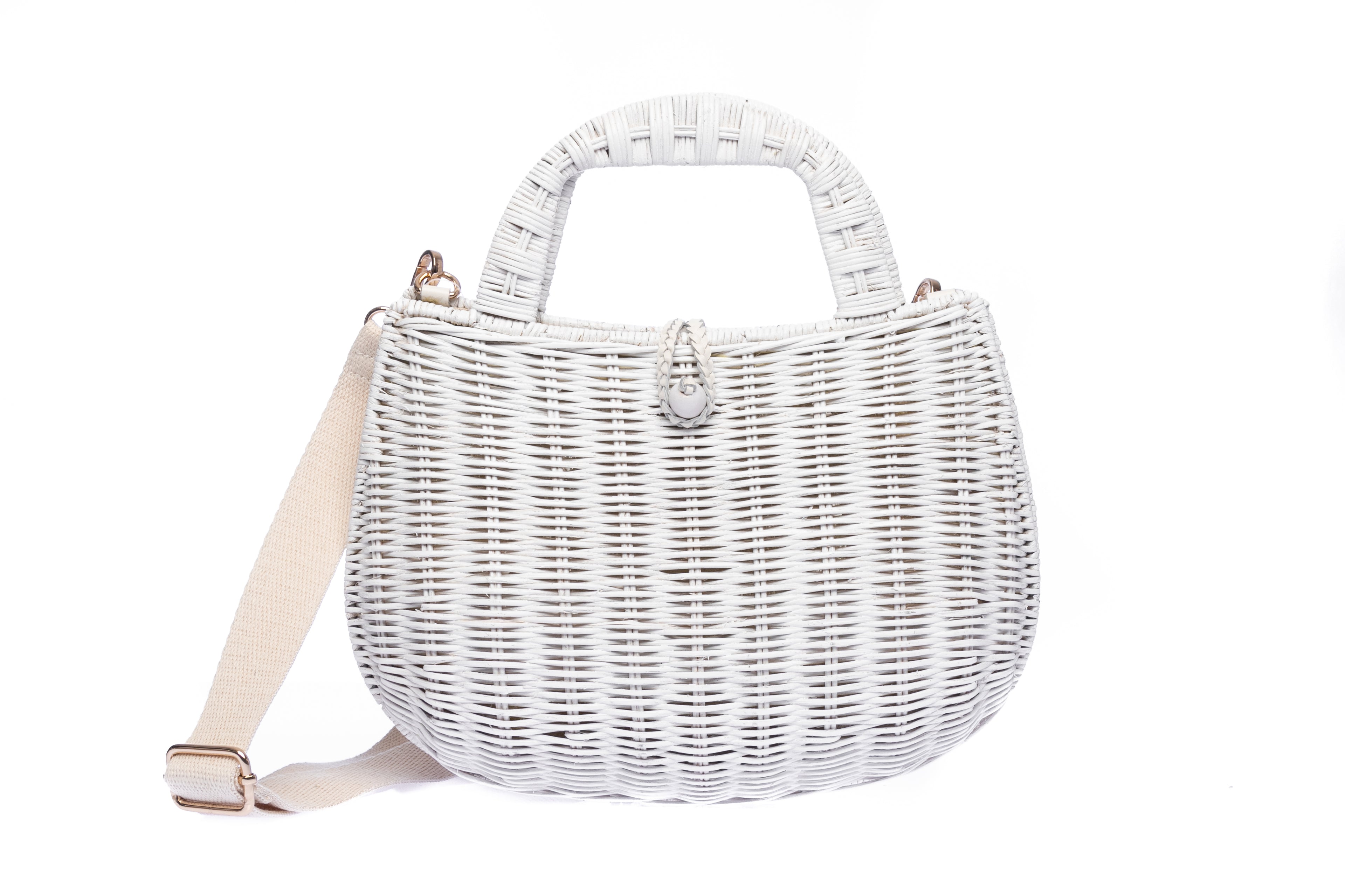 Handwoven Abi Wicker White Rattan Shoulder Bag with adjustable cotton strap and brass hardware, made by artisans in the Philippines. Sustainable and stylish.