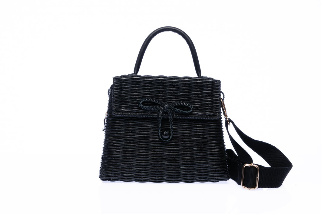 Adie wicker black shoulder bag, handwoven from sustainable rattan with a cotton strap and brass hardware, perfect for eco-conscious style.