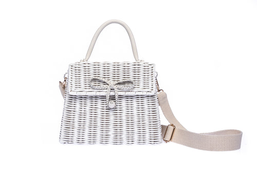 Adie wicker white shoulder bag, handwoven from sustainable rattan, featuring a cotton strap and brass hardware. Eco-friendly and stylish.