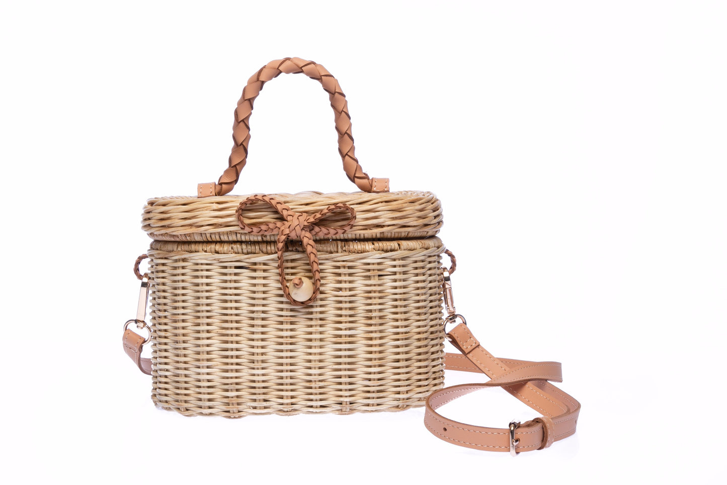 Camille Rattan Shoulder Bag made from handwoven rattan with adjustable leather strap and brass hardware. Eco-friendly and stylish design for any occasion.