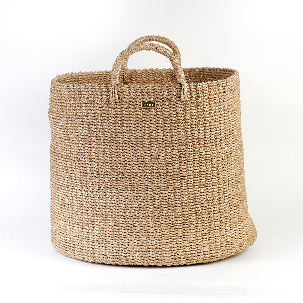 Camille Round Storage Basket made from 100% natural plant fiber, ideal for laundry, toy storage, and organizing essentials. Eco-friendly and stylish design.