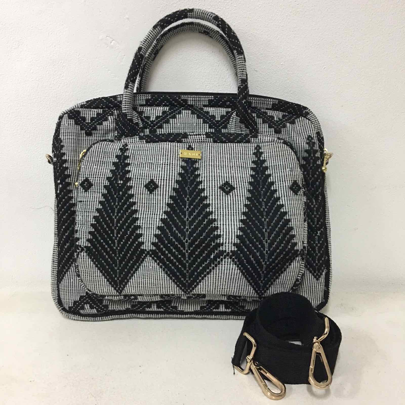 Handwoven Abel Iloco laptop bag with geometric designs, faux suede non-slip top, and handle. Ethically crafted in the Philippines.