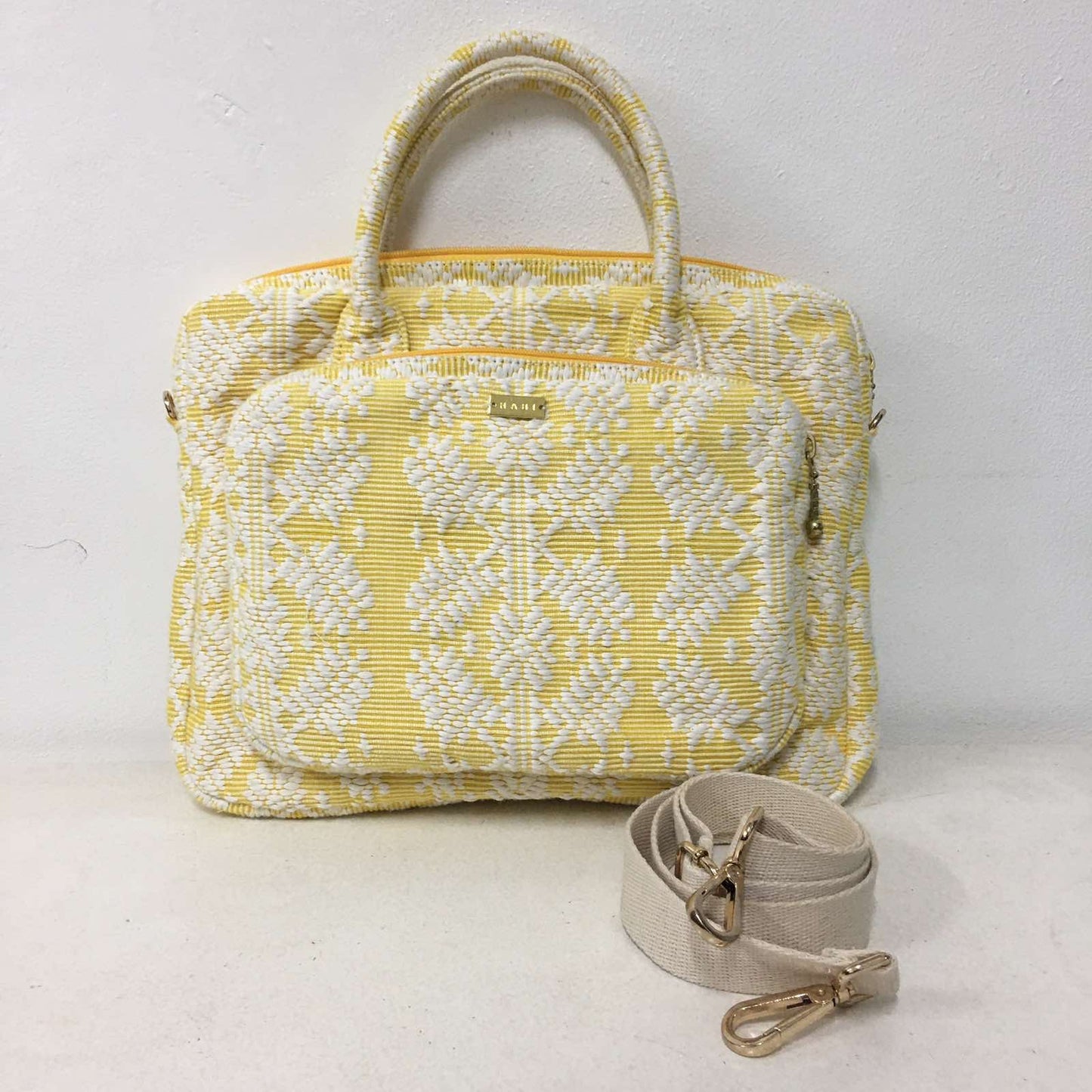 Handwoven Abel Iloco laptop bag with geometric designs, faux suede non-slip top, and handle. Ethically crafted in the Philippines.