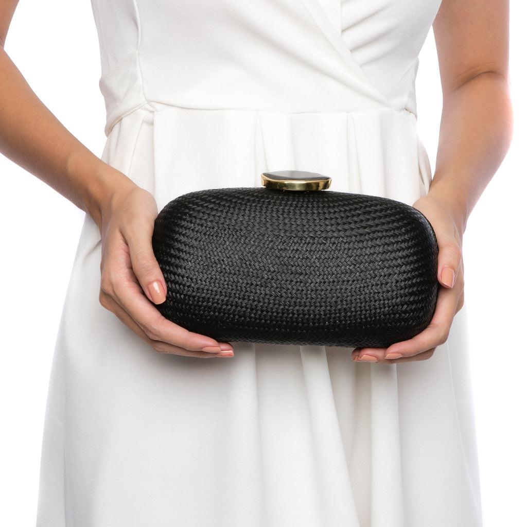 Dark Sky Oval handwoven clutch with agate stone and brass chain strap, perfect for evening events. Ethically made in the Philippines.