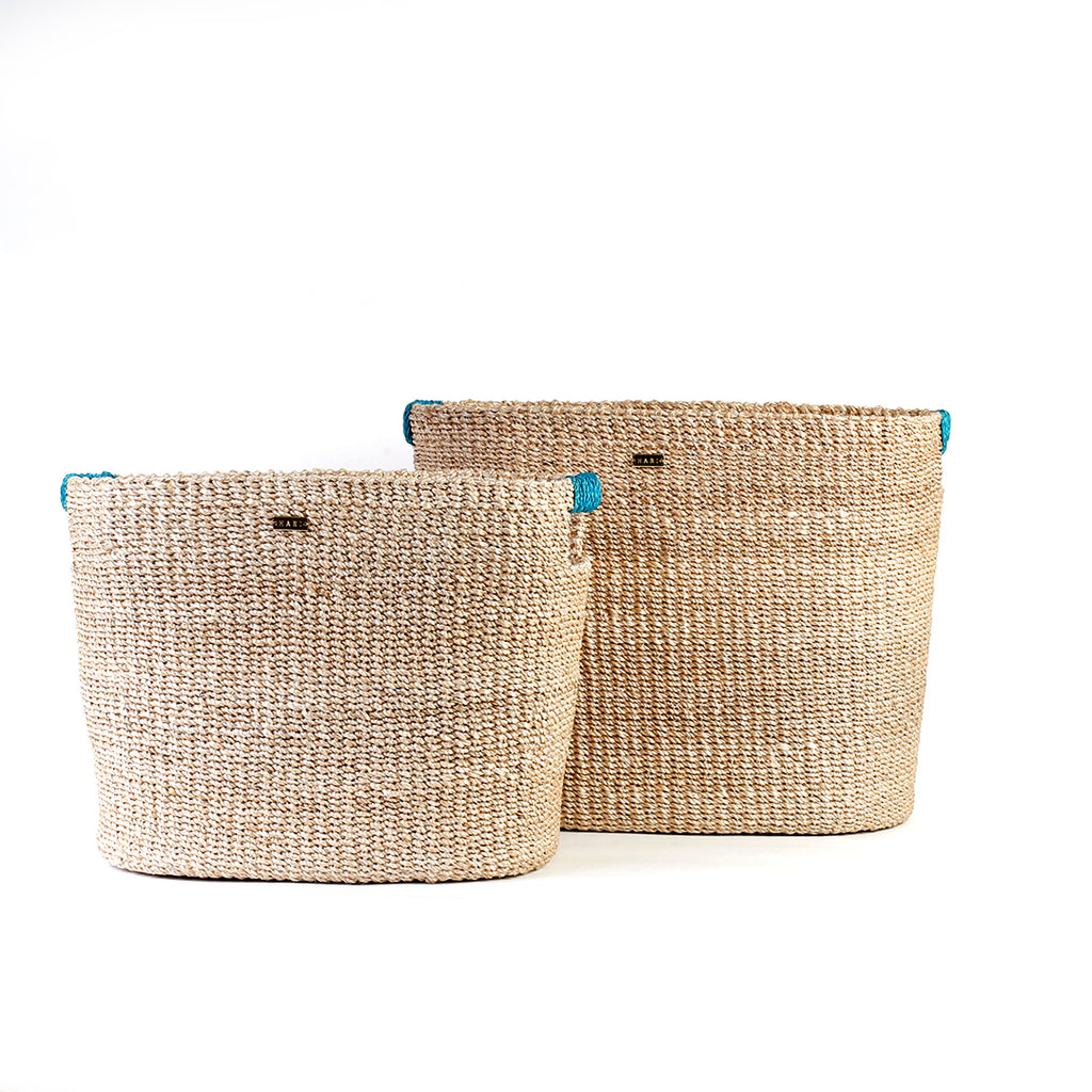 Ivy Oval Storage Baskets Set of 2, handcrafted from natural plant fibers, shown in small and large sizes for stylish and eco-friendly home organization.