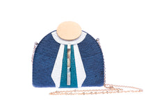 Load image into Gallery viewer, Gatsby Navy half-moon clutch made from handwoven natural plant fibers with a cracked sea shell bar and a brass chain strap, offering elegance and sophistication for evening events.
