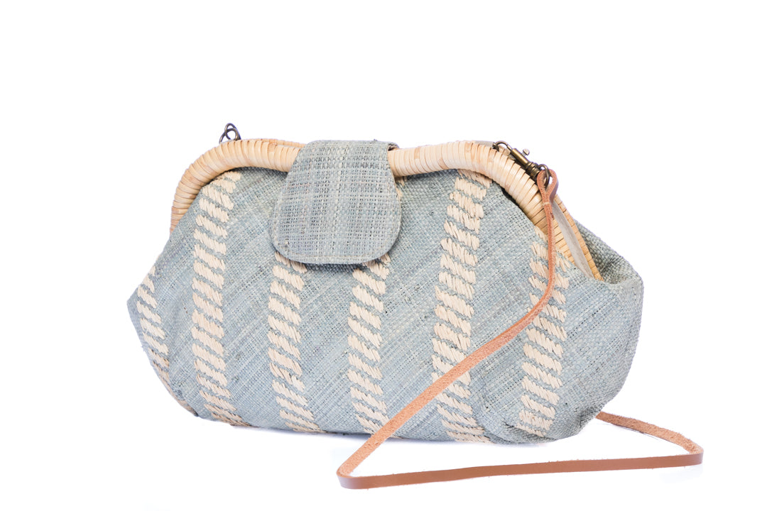 Grey Skye Signature Clutch – Handwoven raffia and rattan clutch with hand embroidery, featuring a removable leather strap for versatile styling.