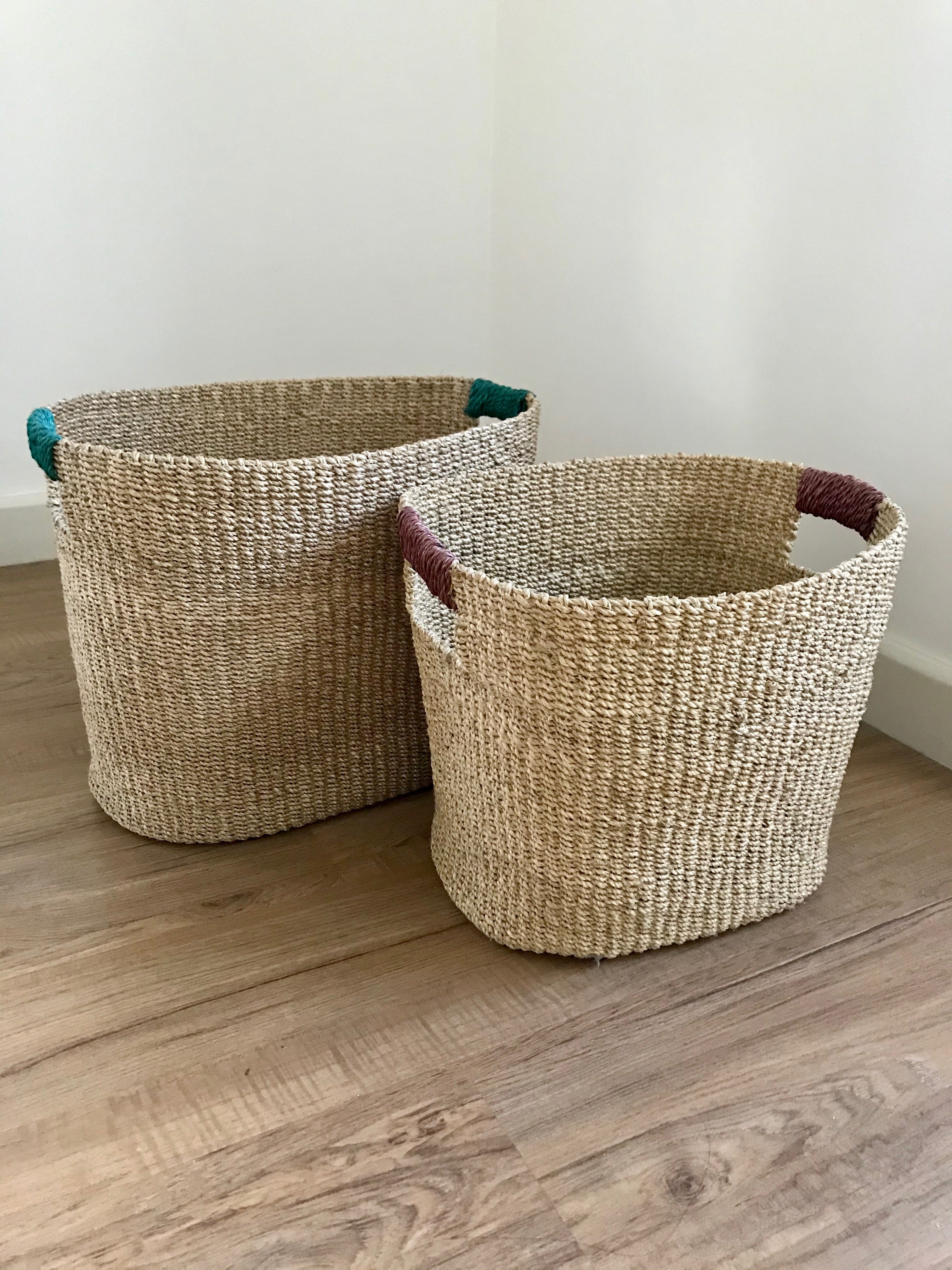 Ivy Oval Storage Baskets Set of 2, handcrafted from natural plant fibers, shown in small and large sizes for stylish and eco-friendly home organization.