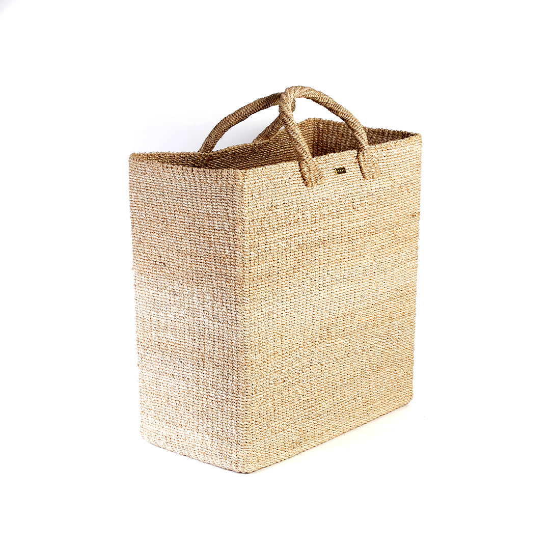 Serene Rectangle Storage basket, handcrafted from natural plant fibers, dimensions 17" Length x 10" Width x 19" Height. Ideal for storing laundry, sports equipment, and seasonal items.