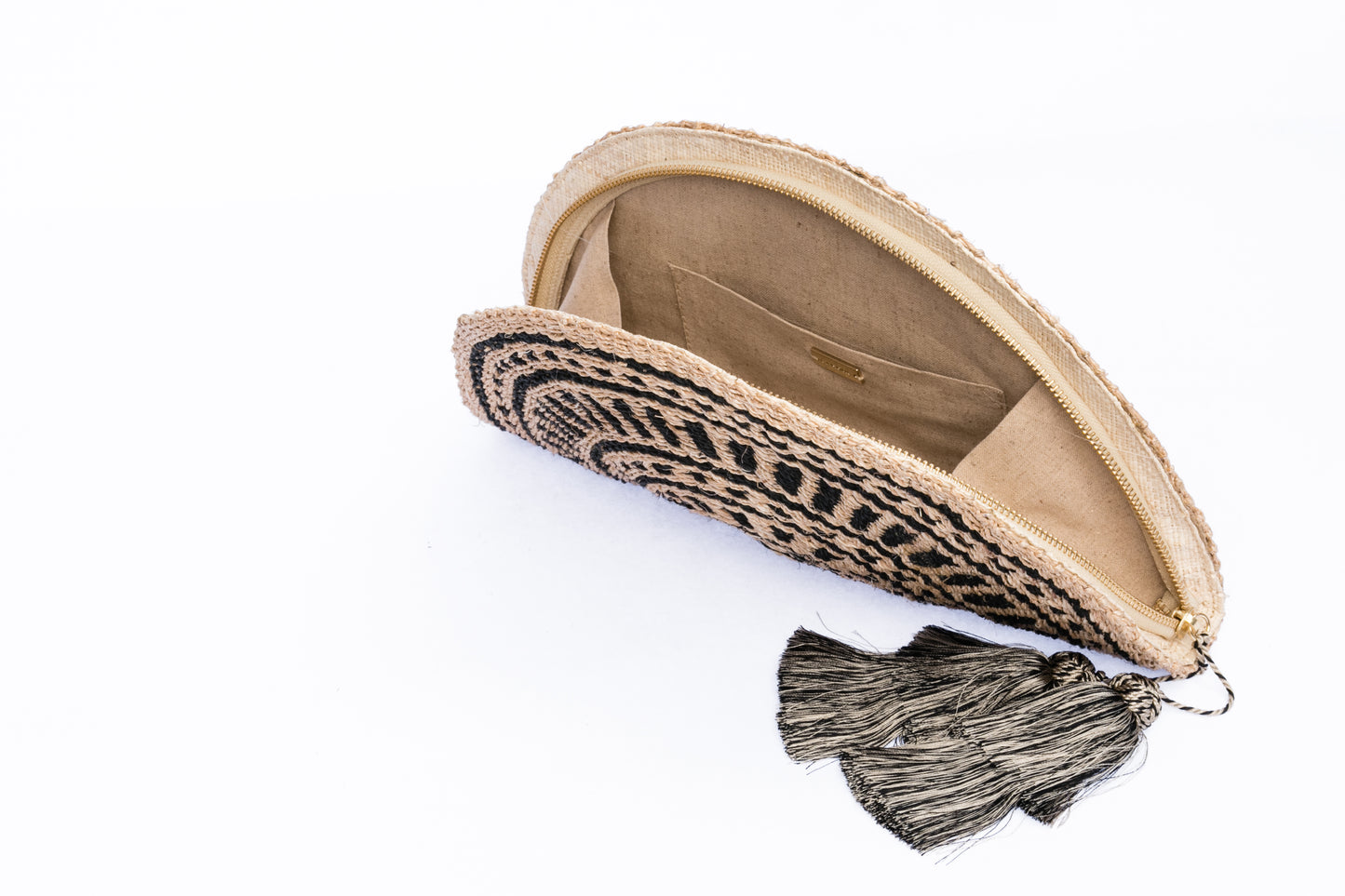 Tiffany Fan Clutch made from 100% abaca, handwoven with eco-friendly craftsmanship, featuring a sleek design and sustainable materials.