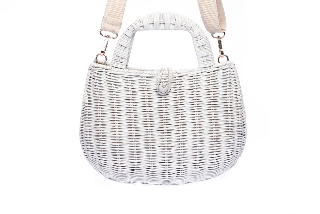 Handwoven Abi Wicker White Rattan Shoulder Bag with adjustable cotton strap and brass hardware, made by artisans in the Philippines. Sustainable and stylish.