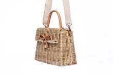 Load image into Gallery viewer, Adie wicker natural shoulder bag, handwoven from sustainable rattan with a cotton strap and brass hardware, eco-friendly and stylish.
